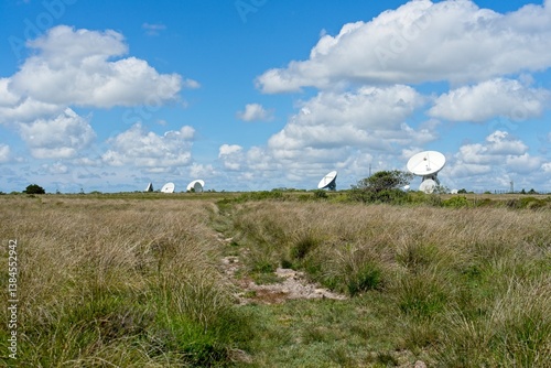 Fototapeta Naklejka Na Ścianę i Meble -  Helston England - 11 June 2024 - Satellite dishes on the Goonhilly Satellite Earth Station on the Goonhillly Downs on the Lizard Peninsula in Cornwall England