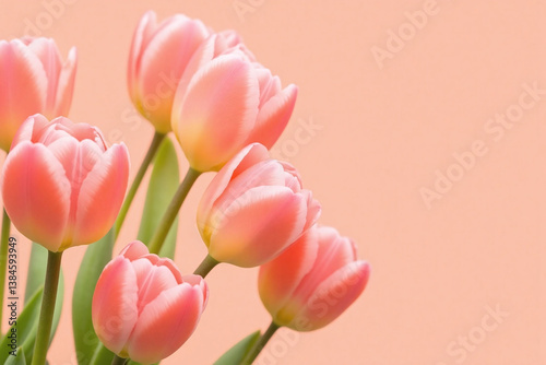 bunch of pink tulips in a vase on a table