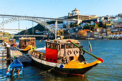 Obraz na płótnie Porto, Portugal. Bridge Ponte Luis I over Douro river. Old traditional boats on the river. w salonie
