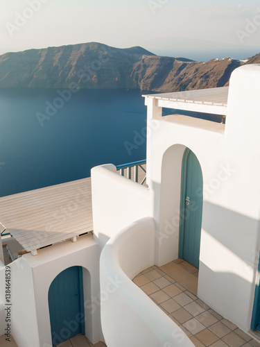 Obraz na płótnie White architecture in Santorini island, Greece. Beautiful terrace with sea view at sunset. w salonie