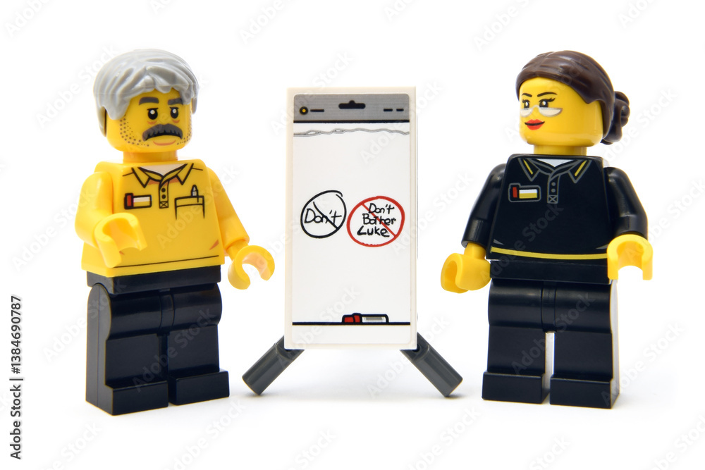 Naklejka premium Lego minifigures of employee or college with presentation of new American fees. Editorial illustrative image of popular plastic toy constructor.