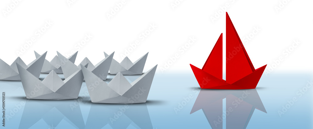 Fototapeta premium Game Changer Concept and Business Innovation Success and new thinking as clever corporate development leadership or motivational leader metaphor for developing new technology as origami boats