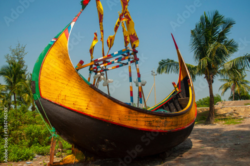 Traditional colorful wooden fishing boat on the beach of Teknaf, Cox's Bazar, Bangladesh.