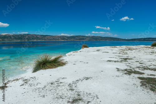 Fototapeta Naklejka Na Ścianę i Meble -  Salda Lake, Burdur, Turkey. View of Salda Lake under the blue sky with white sand and clear water. Turquoise lansdscape