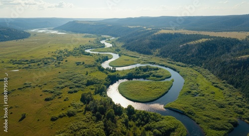 Obraz na płótnie Serene aerial view of winding river through lush valley w salonie