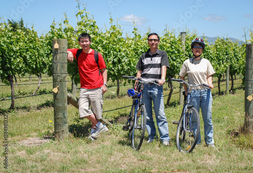 Obraz na płótnie Tourists taking the bike tour of vineyard. Otago. New Zealand. w salonie