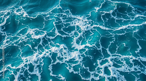 sea water waves seen from above, water and foam texture, blue and white liquid wallpape