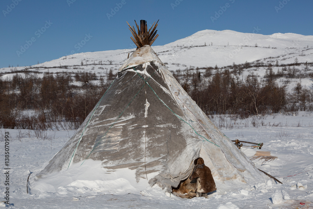 Nenets girl near the entrance to the chum, Yamal