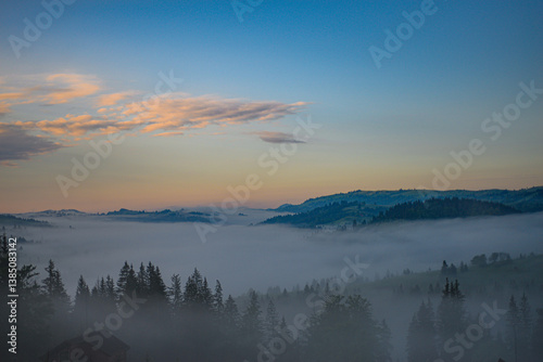 Mountains in the early morning fog