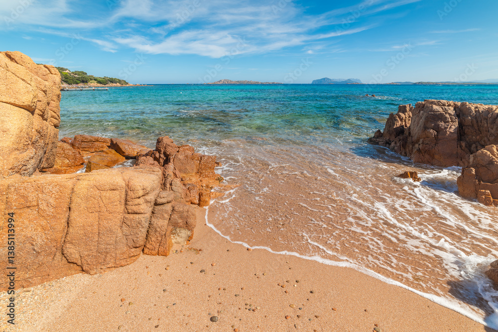 Orange rocks and blue sea in Romazzino beach