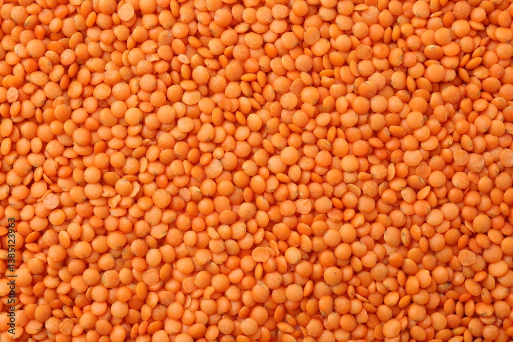 Raw red lentils as background, closeup view Raw red lentils as background, closeup view