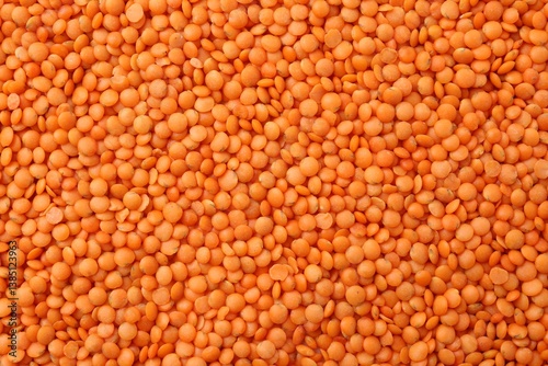 Raw red lentils as background, closeup view