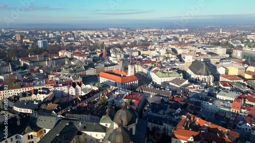 Olomouc, Czech Republic: Aerial forward footage of the ancient Olomouc town hall with the Astronomical Clock and the Church of St. Maurice in the old town in Czech Republic in a early morning light.