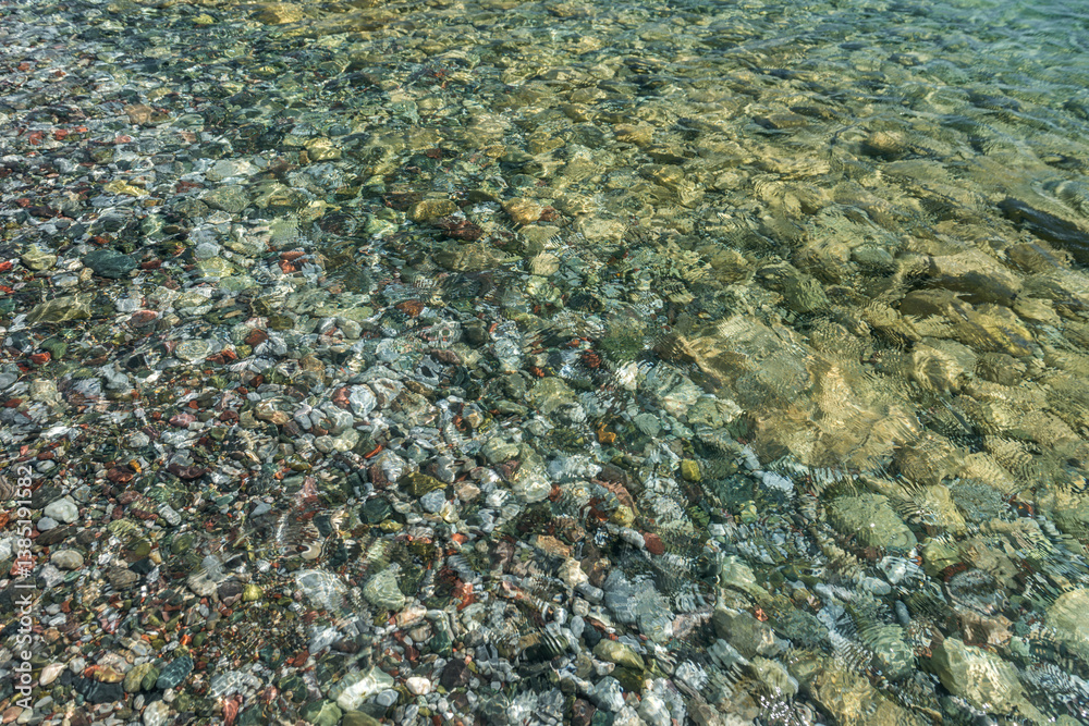 Pebble coast and waves in Datca, Turkey. Clear water of the Mediterranean coast of Turkey. Pebble coast and waves in Datca, Turkey. Clear water of the Mediterranean coast of Turkey.