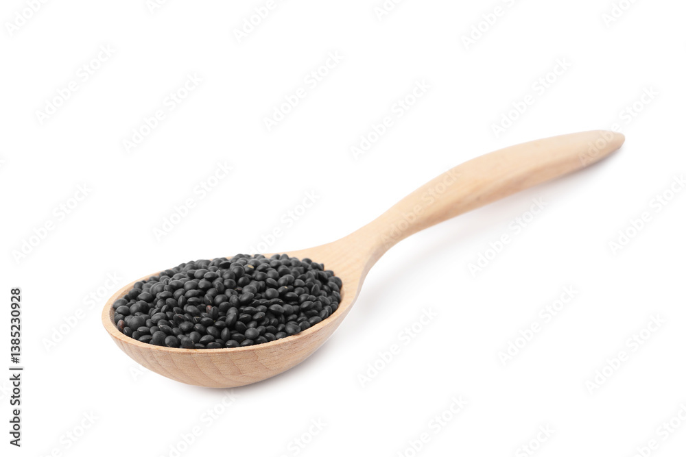 Raw lentils in wooden spoon isolated on white Raw lentils in wooden spoon isolated on white