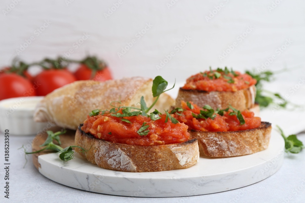 Tasty bread with tomatoes and parsley on light table, closeup Tasty bread with tomatoes and parsley on light table, closeup