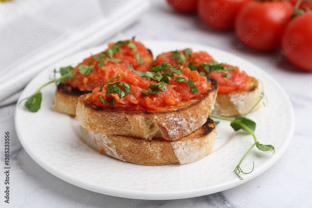 Tasty bread with tomatoes and parsley on white marble table, closeup