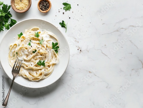 A plate of creamy fettuccine Alfredo topped with freshly grated parmesan and parsley. Featuring richness and tradition
