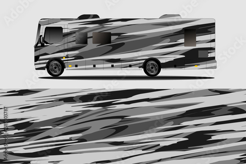 Stylish gray and black patterned RV parked on a smooth surface, showcasing modern design elements
