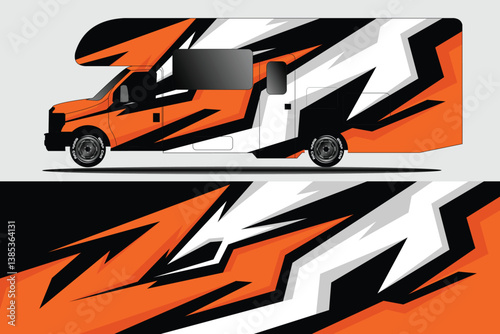 Vibrant orange and black patterned RV showcasing dynamic design against a neutral background
