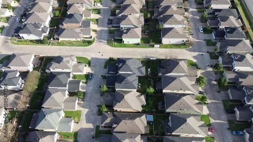 Cluster house strata landed housing in Fairbanks, Northwest Crossing area in North Houston, Texas, new development two story residential single family home front garage, compact backyard, flyover