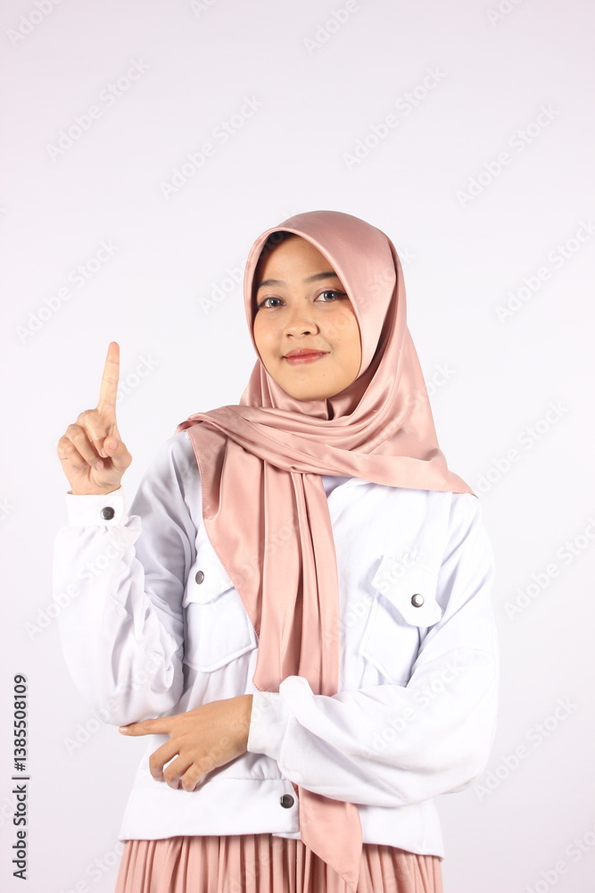 Hand gesture and praying concept. Serious dark skinned female raises hands Hand gesture and praying concept. Serious dark skinned female raises hands