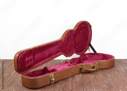 Musical instrument - Front and side view Open brown electric guitar hard case
