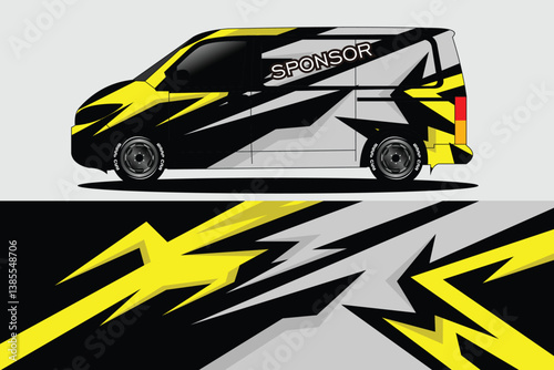 Stylishly designed van with bold yellow and black graphics showcasing dynamic patterns, parked in an urban setting