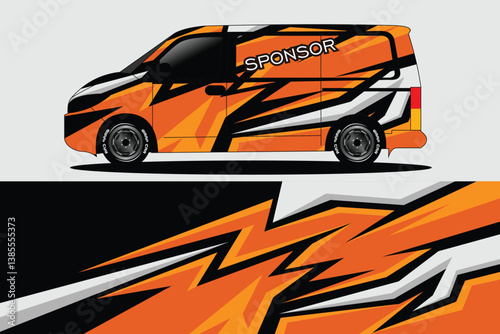 Vibrant orange and black van with dynamic design parked on a street, showcasing modern graphics
