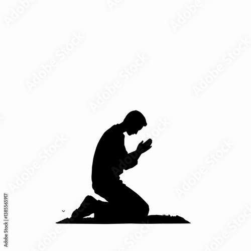 Silhouette of Man Kneeling and Praying in Black and White