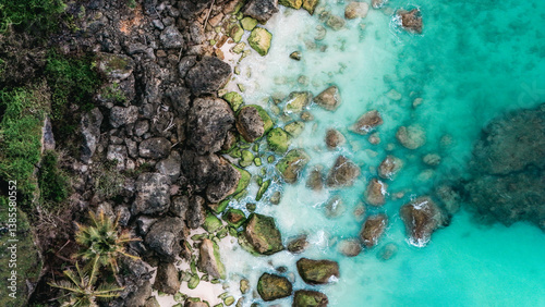 Fototapeta Naklejka Na Ścianę i Meble -  Serene tropical coastline with turquoise waves kissing white coral sand. summer background and summer holiday concept.