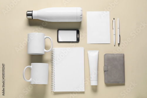 Different blank items for branding on beige background, flat lay. Mockup for design