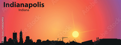 The black silhouette of the city of Indianapolis, Indiana against the backdrop of a picturesque sunset	