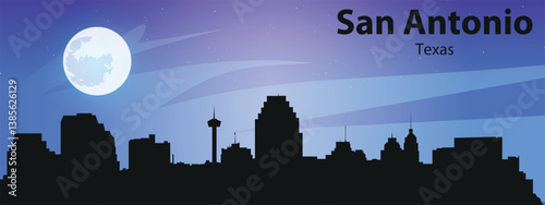 Black silhouette of the San Antonio city skyline against the starry sky and big moon