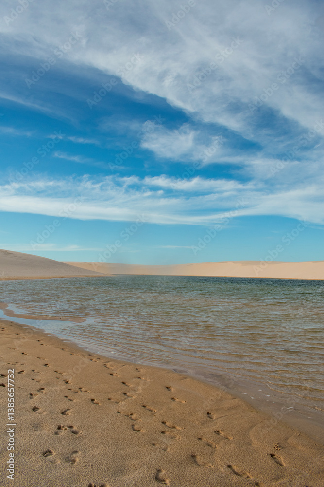 Barreirinhas, Maranhao State National Park, Brazil: view of Lencois Maranhenses, white and rolling sand dunes with natural pools of fresh water, desert landscape, world's unique natural beauty Barreirinhas, Maranhao State National Park, Brazil: view of Lencois Maranhenses, white and rolling sand dunes with natural pools of fresh water, desert landscape, world's unique natural beauty