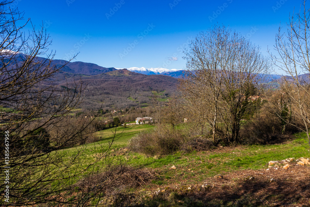 Panorama of Pic des Trois Seigneurs on the horizon and the Douctouyre Valley from the Ariège village of Roquefixade in spring Panorama of Pic des Trois Seigneurs on the horizon and the Douctouyre Valley from the Ariège village of Roquefixade in spring