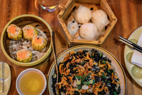 Photography Dim sum dumplings: shu mai, har how, black rice with shrimp, Chinese restaurant
