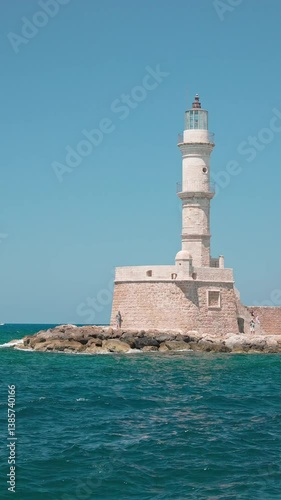 Vertical handheld shot of old lighthouse in Chania, Crete, Greece