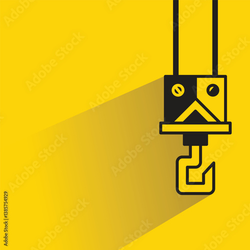 industrial crane hook icon with shadow yellow background