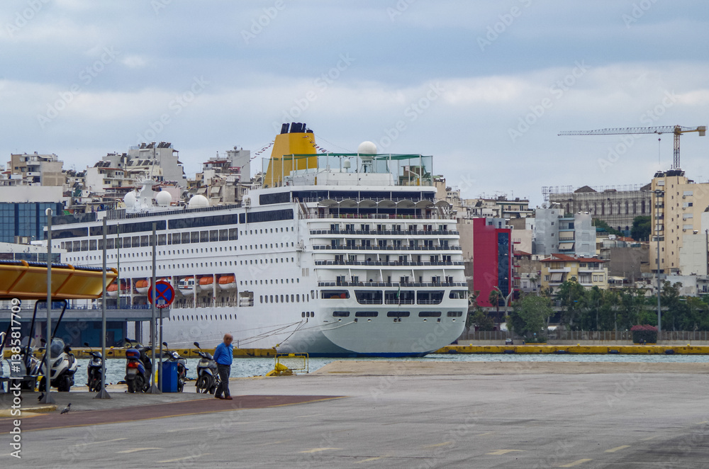Classic cruiseship or cruise ship liner Neo Riviera in Piraeus Athens, Greece port on sunny day blue sky during Mediterranean Aegean Greek islands summer cruising dream vacation