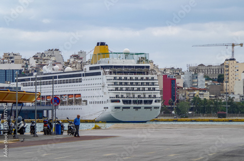 Obraz na płótnie Classic cruiseship or cruise ship liner Neo Riviera in Piraeus Athens, Greece port on sunny day blue sky during Mediterranean Aegean Greek islands summer cruising dream vacation w salonie