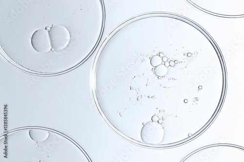 The texture of a cosmetic serum or body gel in a Petri dish.