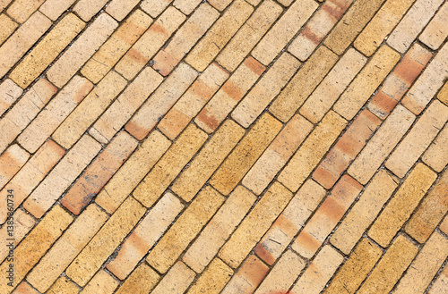 Schilderij op canvas The surface is made of yellow, narrow clinker bricks (tiles) in close-up
