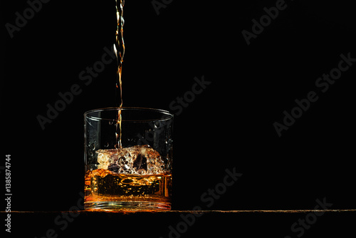 Bourbon in a glass on old wood table