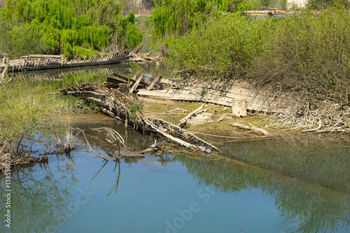 Obraz na płótnie The cemetery of the Burci, typical Venetian merchant boats from the early 1900s once used for river trade, in a bend of the Sile River near Casale sul Sile, near the city of Treviso, Italy w salonie