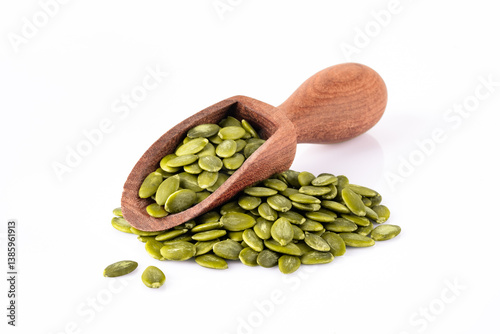 Delicious pumpkin seeds on white background