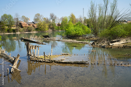 Obraz na płótnie The cemetery of the Burci, typical Venetian merchant boats from the early 1900s once used for river trade, in a bend of the Sile River near Casale sul Sile, near the city of Treviso, Italy w salonie