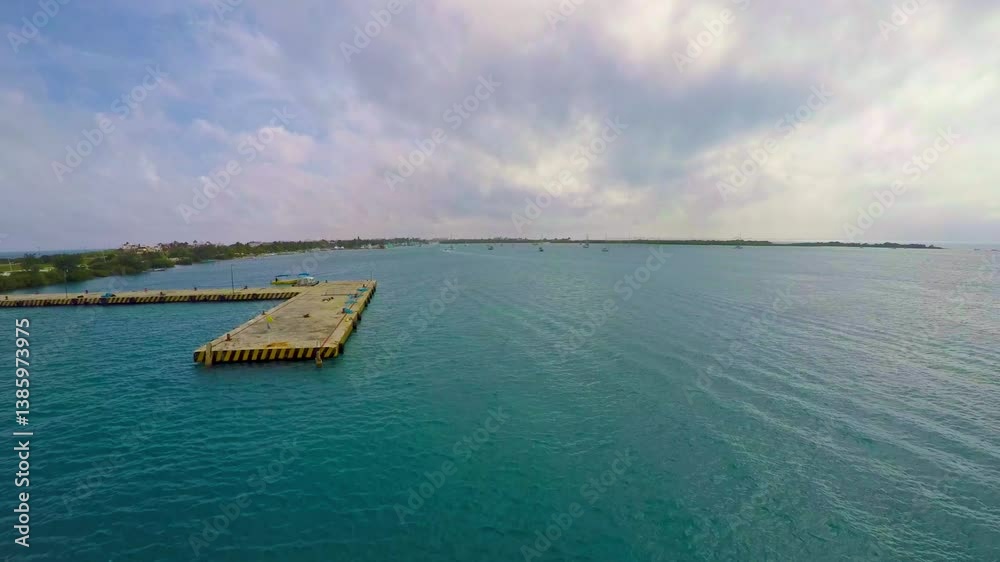 Concrete pier extending into isla mujeres bay, quintana roo, mexico