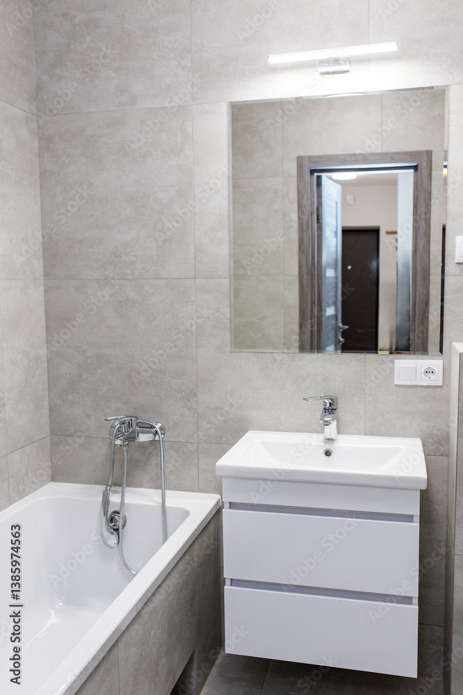 Fototapeta premium Modern bathroom with bathtub and wall mirror