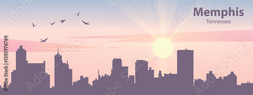 The silhouette of the city of Memphis, Tennessee against the backdrop of the sunset and pink clouds. It is also made in pastel colors